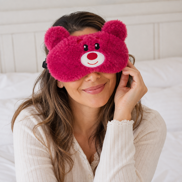 Cute animal sleep eye mask in soft plush - held in hand for scale