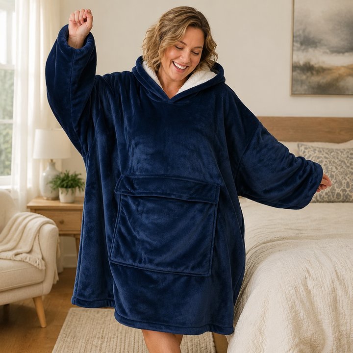 Warm blanket hoodie for adults shown on the sofa
