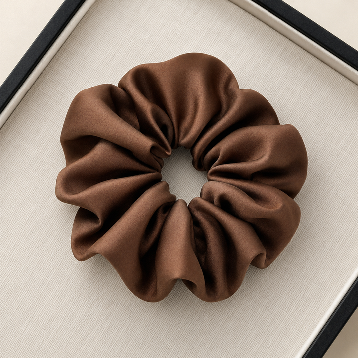 Satin hair scrunchie with a wide soft band - satin surface close up