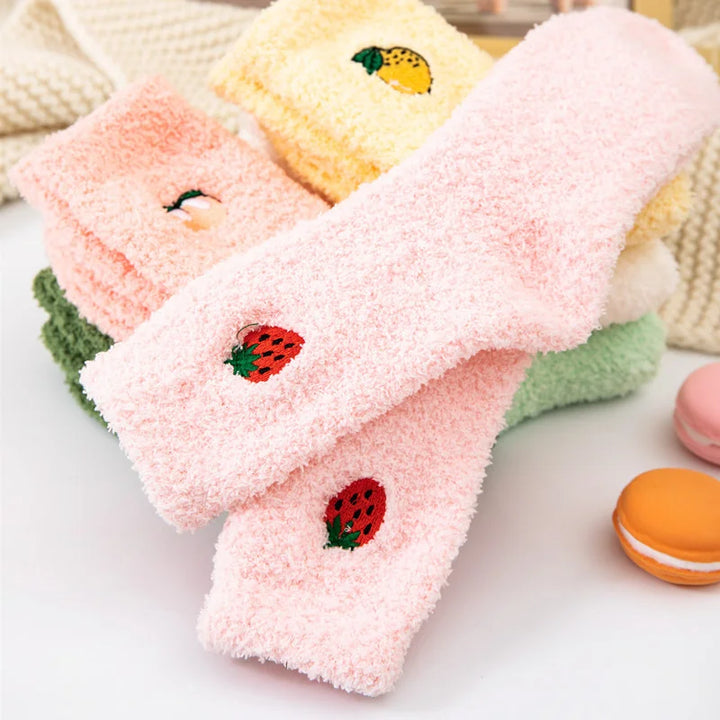 Soft fuzzy socks for women in pink with an embroidered strawberry