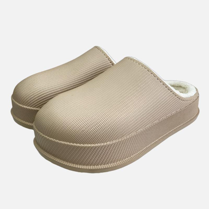 Woman wearing soft cushioned slippers for women in beige