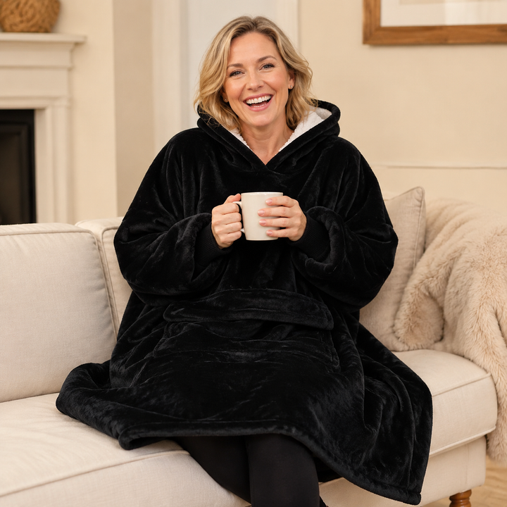 Hooded blanket with sleeves shown from the back