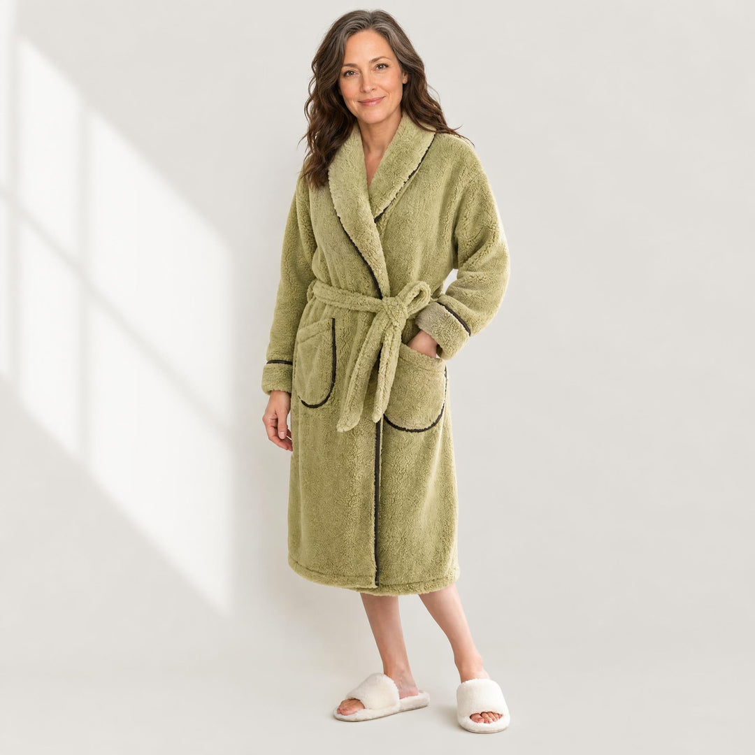 Woman wearing a long warm flannel fleece robe in cream
